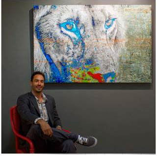 A picture of the artist next to his picture of a lion